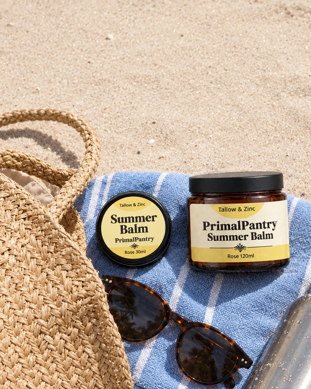 Summer Balm in a beach bag with a towel and sunglasses